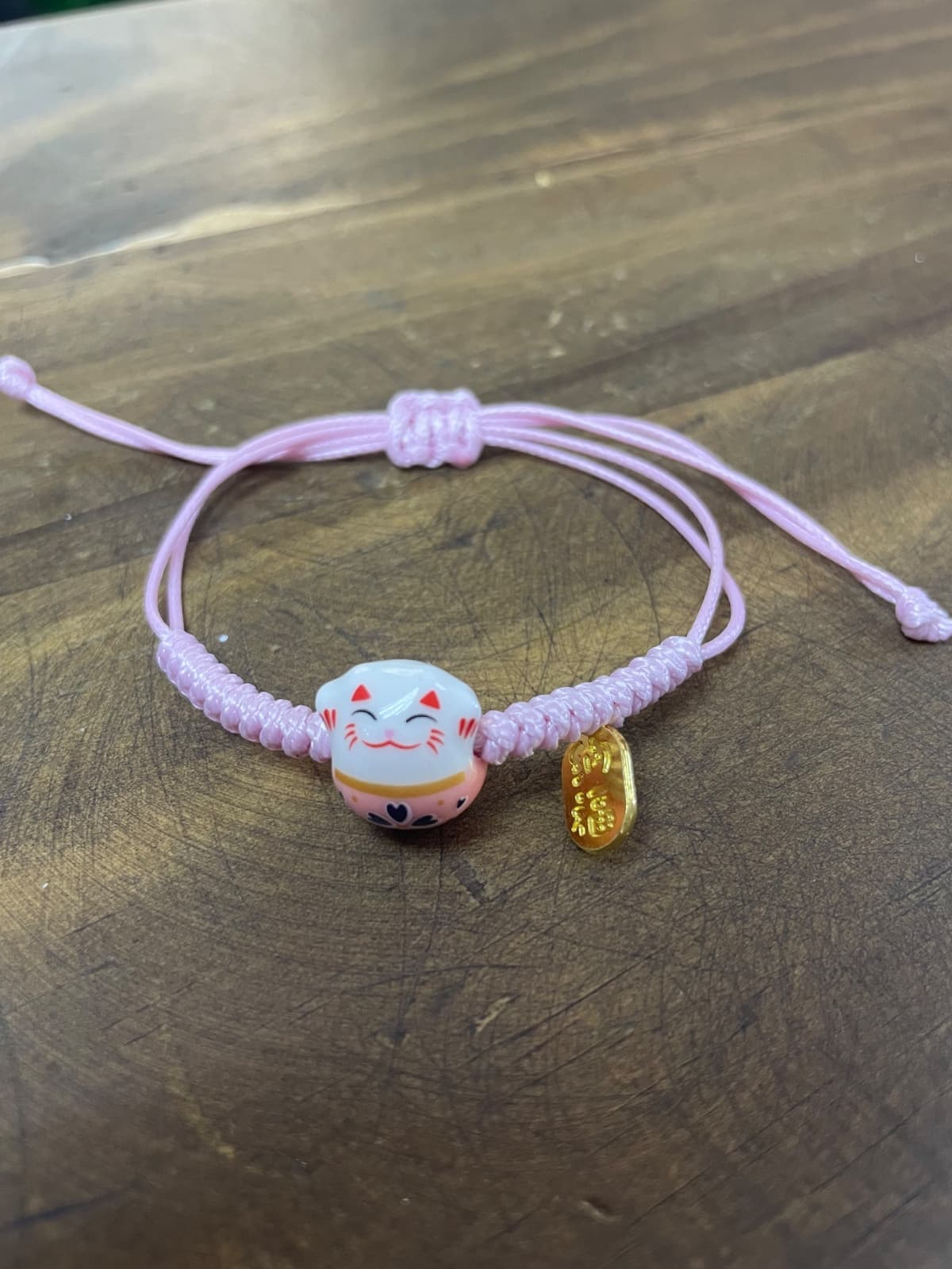 Pulsera gatito buena suerte hilo rosa