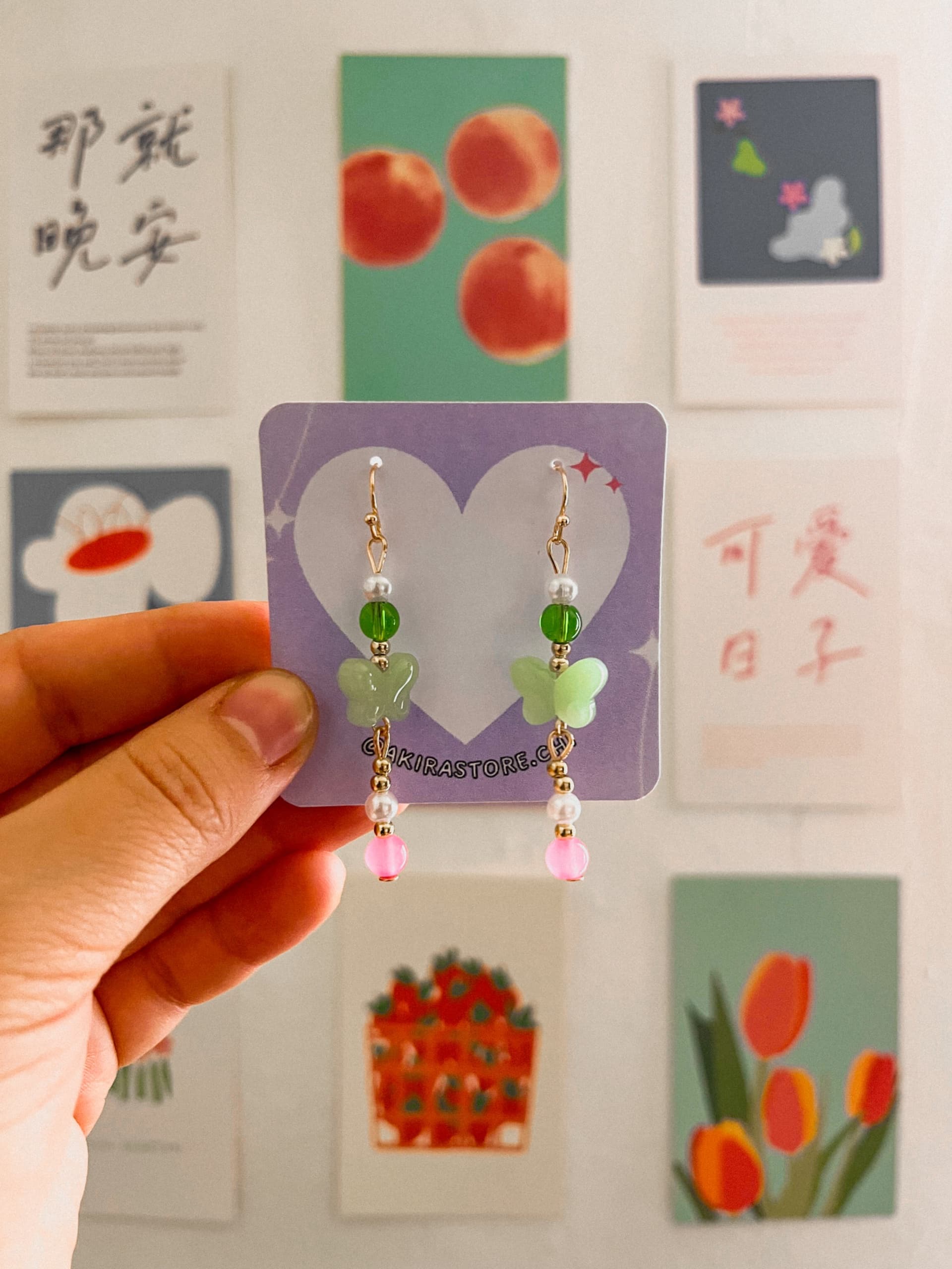 aros mariposa verde con rosado